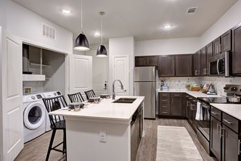 Kitchen with island and chairs